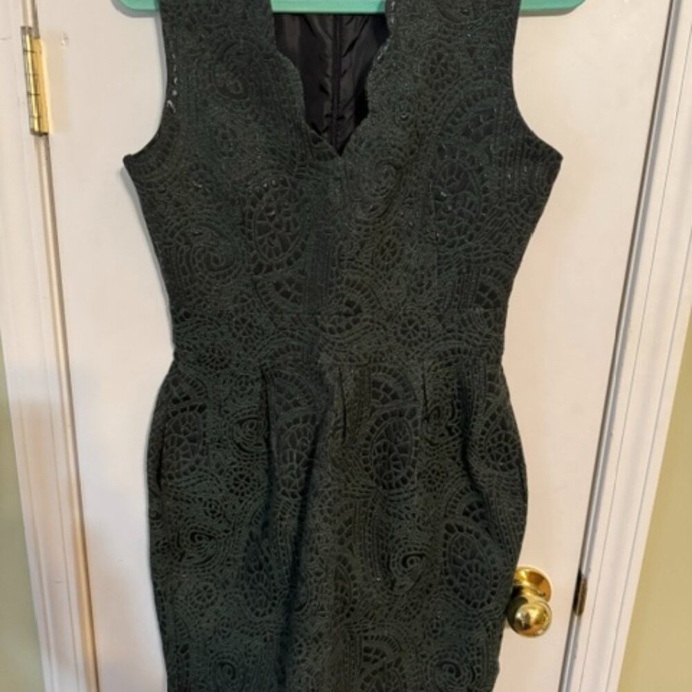 Gorgeous dark green dress. Scalloped neckline